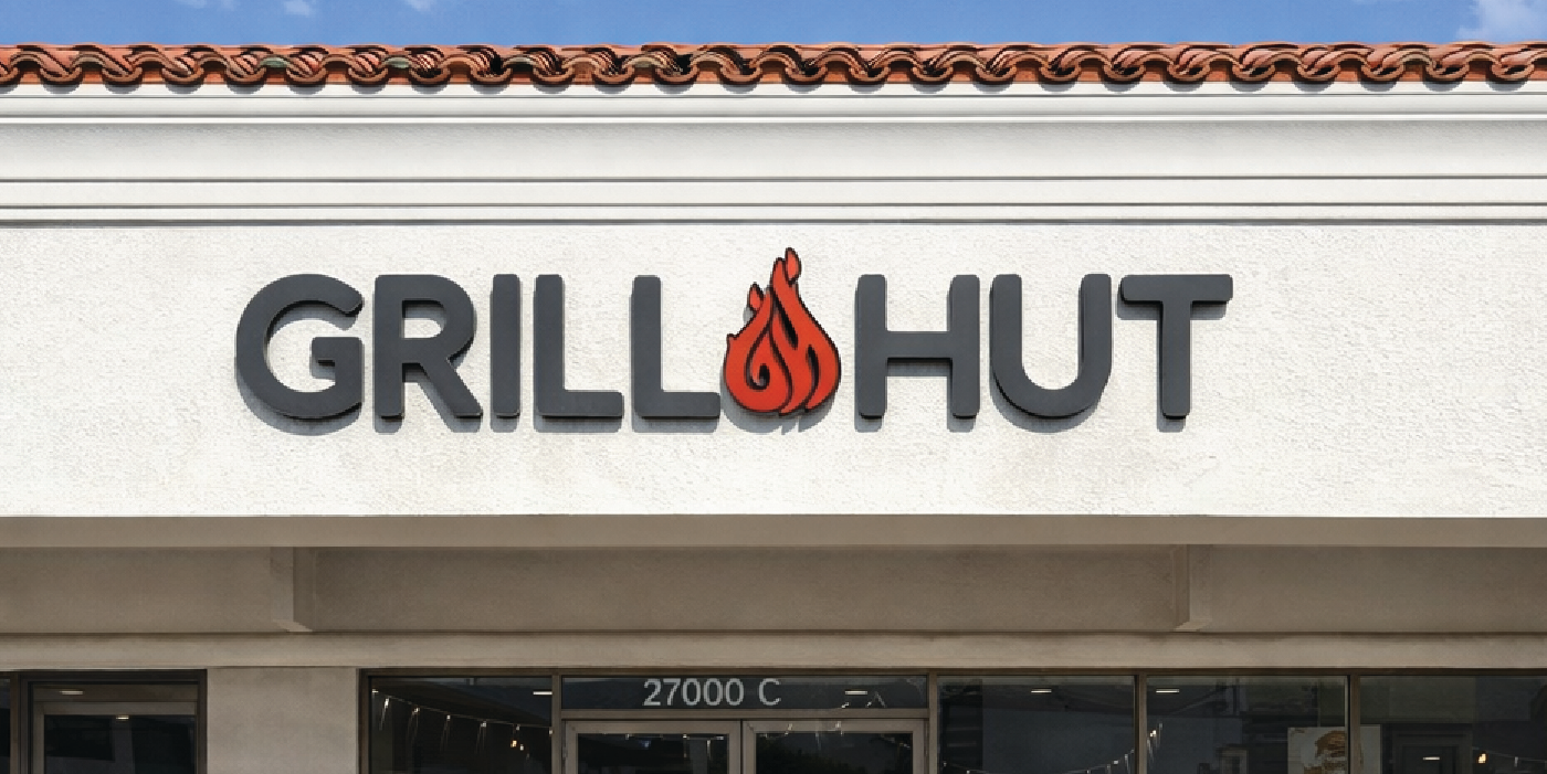 Grill Hut exterior signage during the day