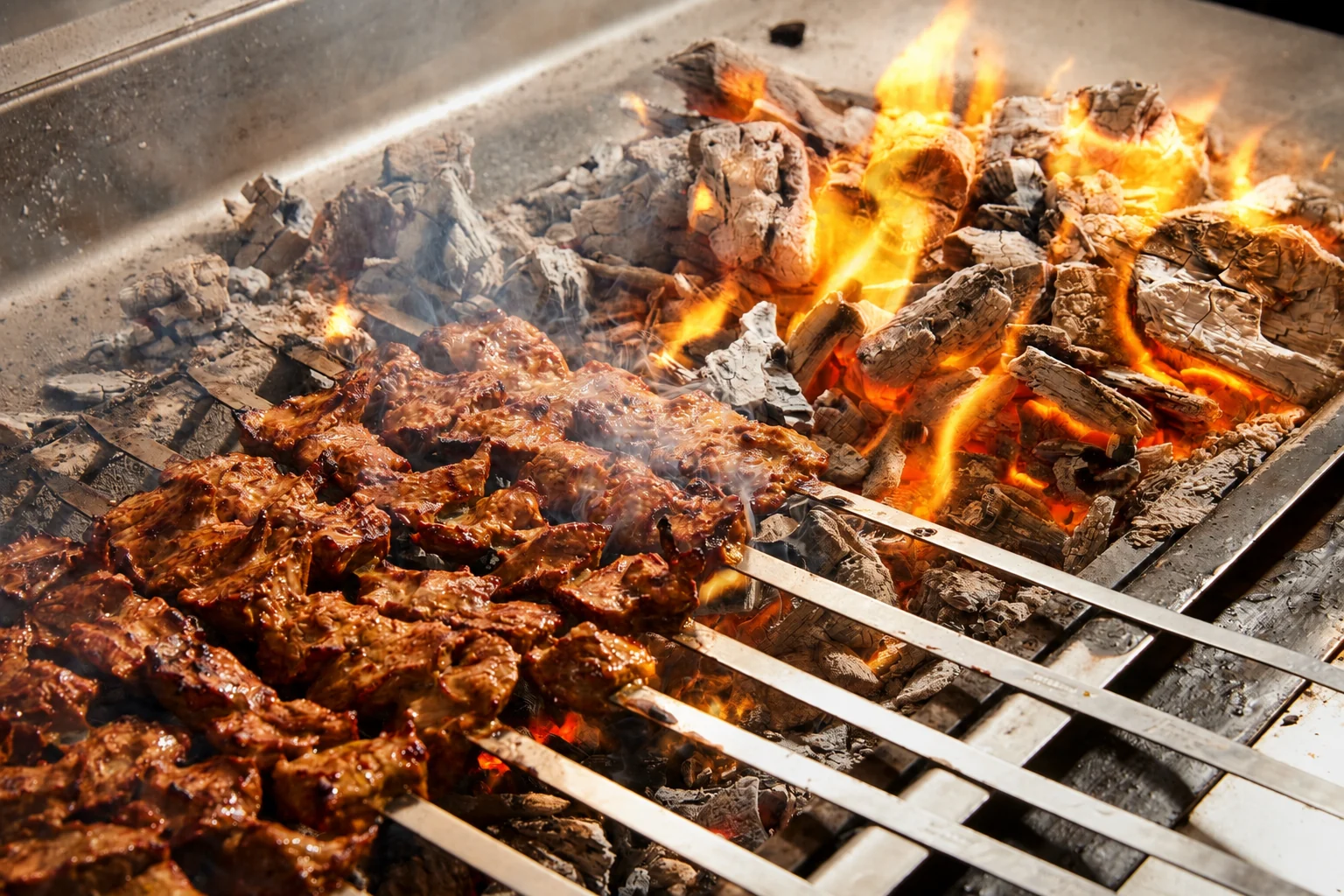 Skewers grilling over open flame for Grill Hut