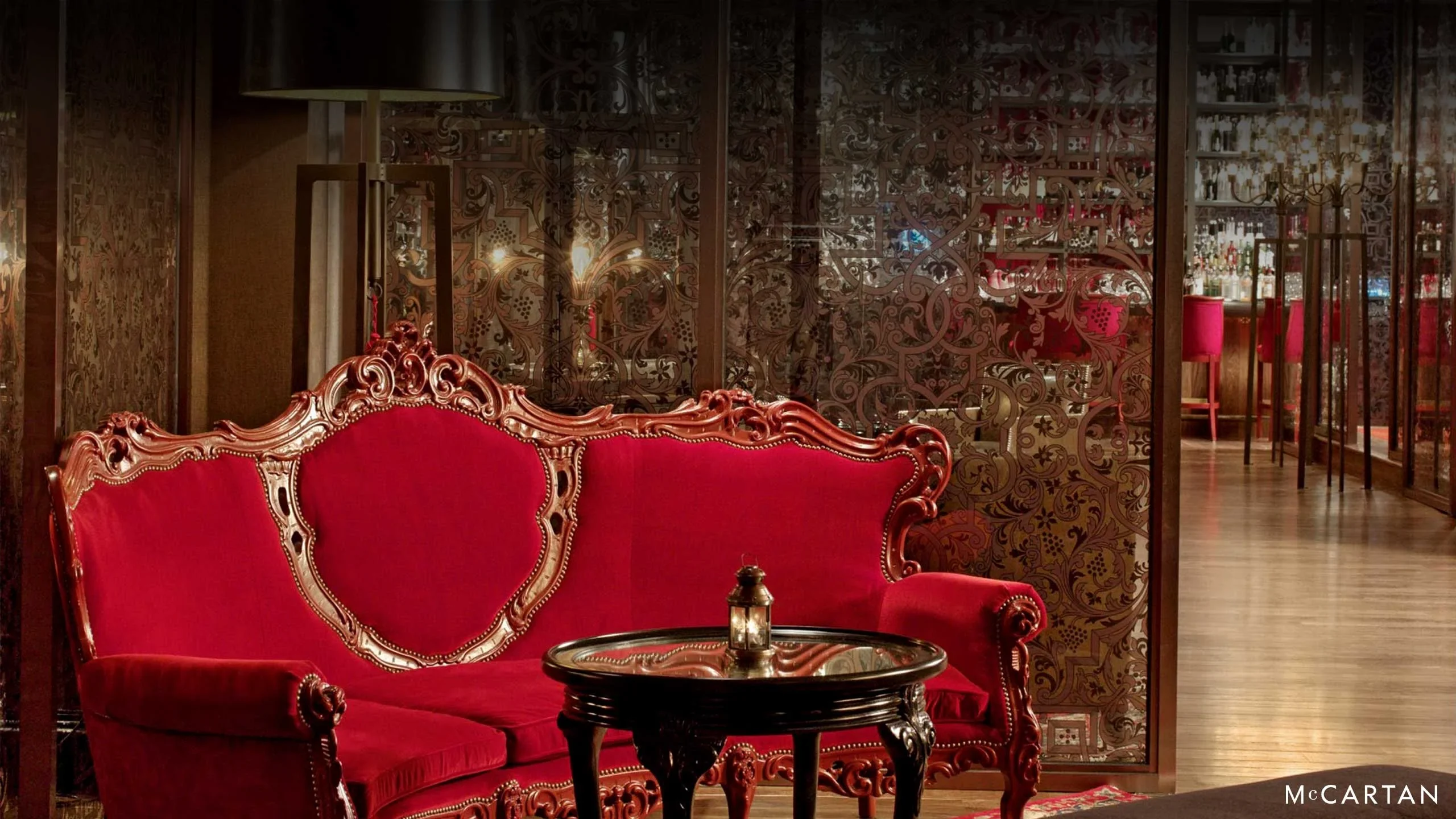 Crimson Lounge at Hotel SAX Chicago with red seating, patterned glass, and bar interior