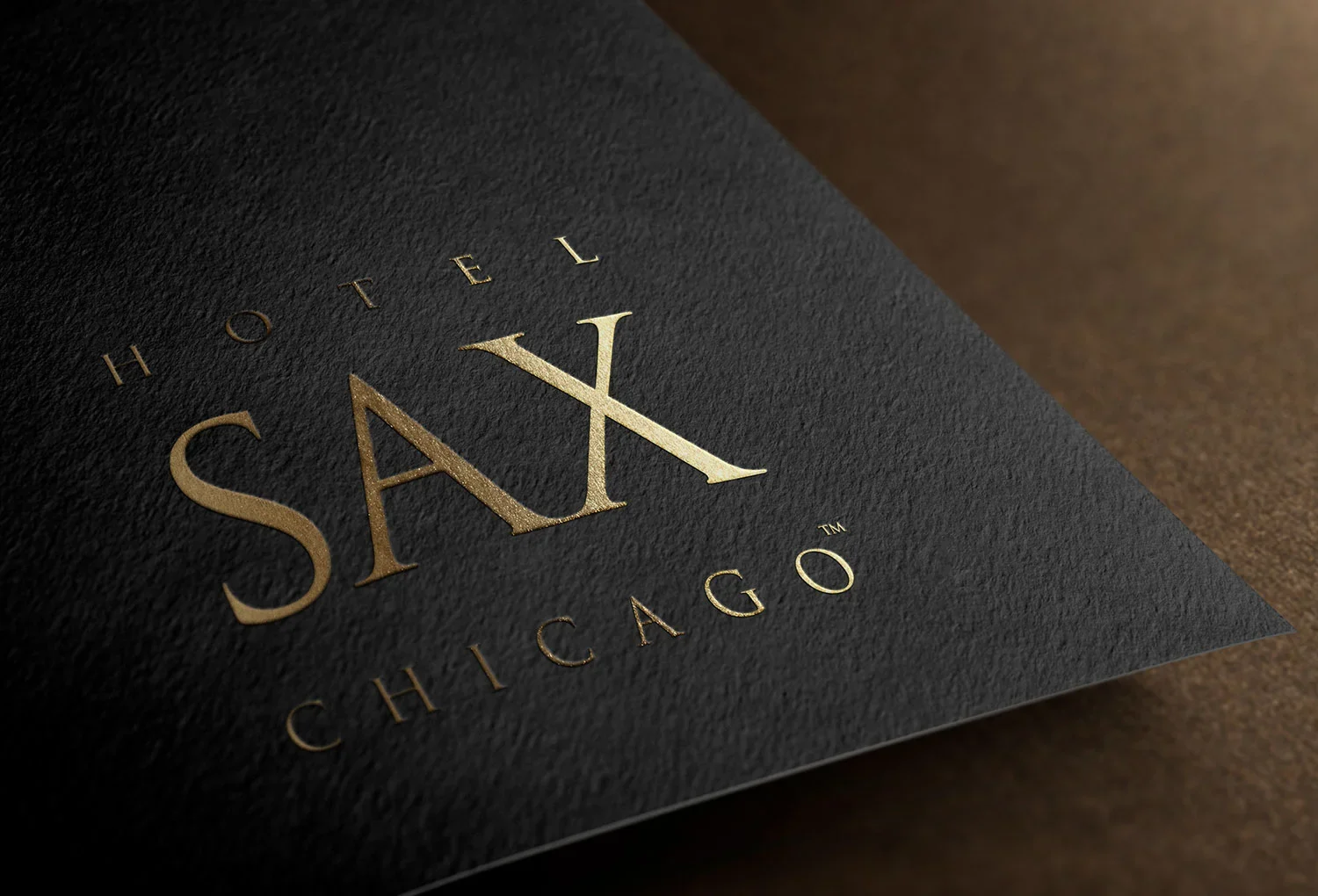 Hotel SAX Chicago gold logo on black textured card
